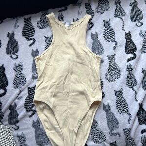 Cream Sleeveless High-Cut Bodysuit